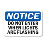 NOTICE Do Not Enter When Lights Are Flashing