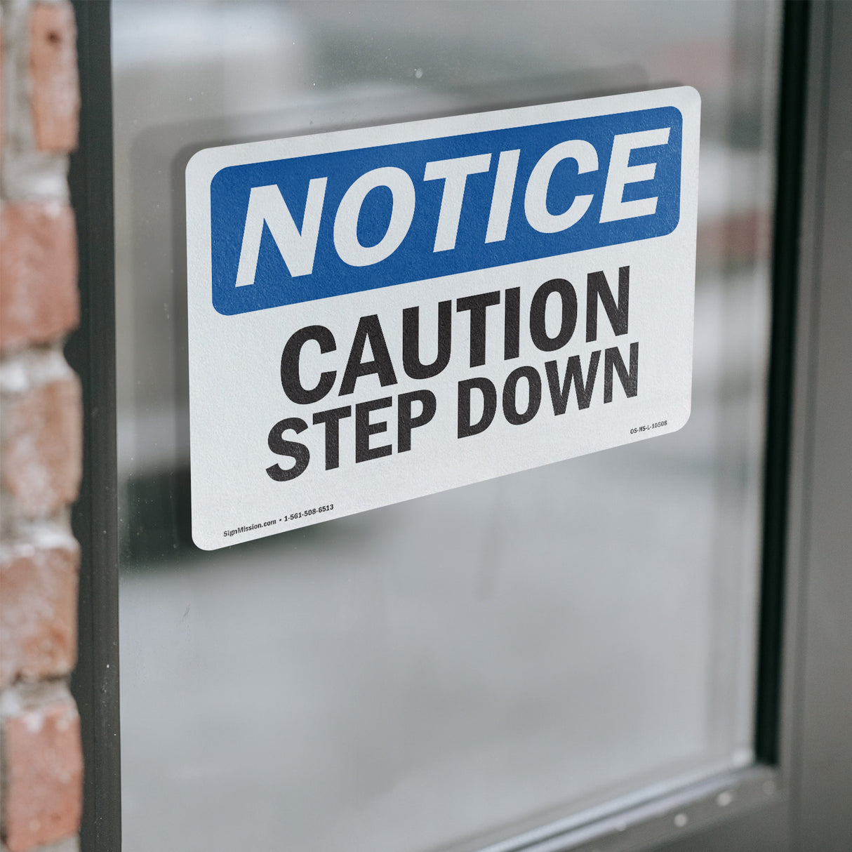 Caution Step Down Sign