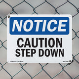 Caution Step Down Sign
