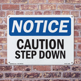 Caution Step Down Sign