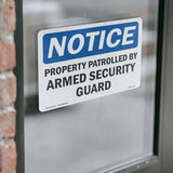 NOTICE Patrolled By Armed Security Guard