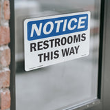 NOTICE Restrooms This Way