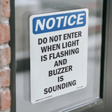 Do Not Enter When Light Is Flashing And Sign