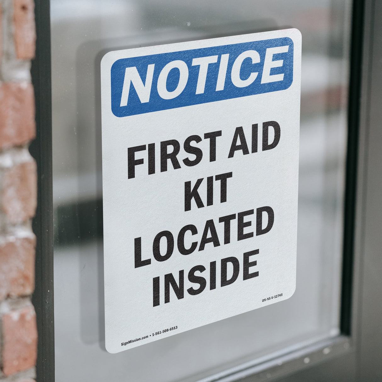 First Aid Kit Located Inside Sign
