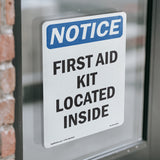 First Aid Kit Located Inside Sign