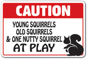 CAUTION YOUNG SQUIRRELS OLD SQUIRRELS AT PLAY Sign