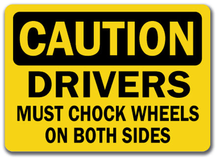 Caution Sign - Drivers Must Chock Wheels On Both Sides